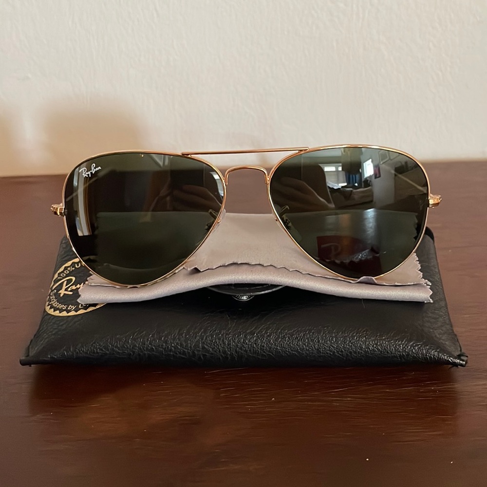Ray Ban aviator gold sunglasses.
